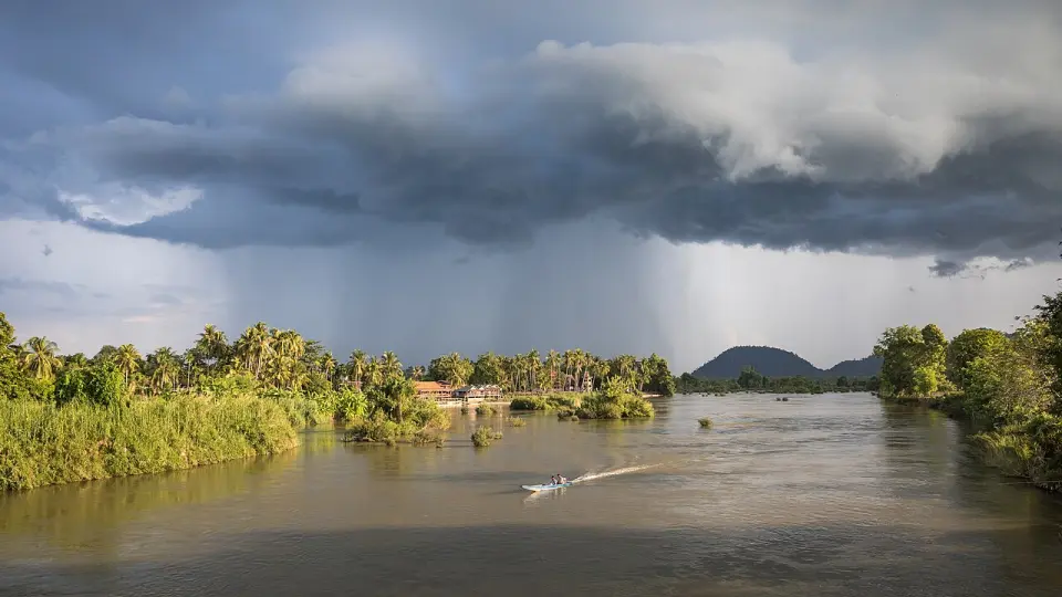 A pirogue on the Mekong at Champasak at golden hour